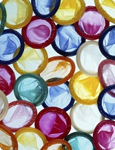 Collection of colorful condoms in various shades of blue, pink, yellow, green, and orange.