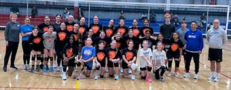 Youth Volleyball Skills and Drills Teams in orange and black volleyball t-shirts with coaches