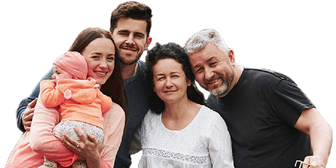Smiling family of five posing together, including a baby in a pink hat and orange outfit.