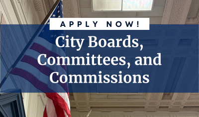 Apply now for City Boards, Committees, and Commissions. American flag visible in the background.