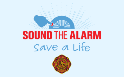 "Sound the Alarm, Save a Life" campaign logo with a hand pressing a smoke detector button and a firefighter badge.