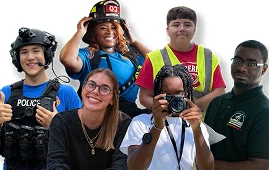 Group of diverse young people in various career uniforms, smiling and looking at the camera.