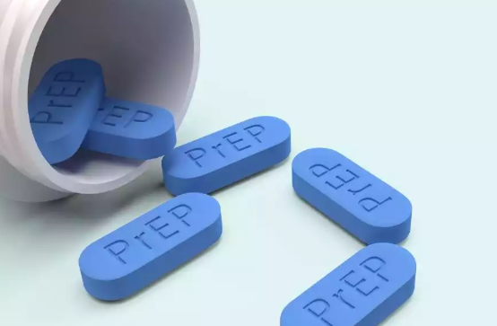 Pill bottle spilling blue, oblong pills with 